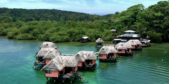 Experience a truly unique eco-lodge getaway at Eclypse de Mar Acqua Lodge on Isla Bastimentos in the Bocas del Toro archipelago of Panama. Nestled amidst lush rainforest, this secluded retreat offers overwater bungalows with panoramic sea views, eco-friendly amenities, and a tranquil atmosphere. Dive or snorkel in vibrant coral reefs, kayak through crystal-clear waters, and explore the surrounding rainforest on guided tours. Indulge in delicious cuisine at the on-site restaurant while enjoying the ocean breeze. Immerse yourself in the natural beauty of Bocas del Toro at this unforgettable eco-lodge.