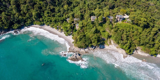 Arenas del Mar Beach and Nature Resort, nestled in the stunning Manuel Antonio, Costa Rica, is a captivating haven where luxury and environmental sustainability intertwine. Set amidst lush rainforests and overlooking the Pacific Ocean, our resort offers an unparalleled experience. Immerse yourself in the eco-friendly luxury of our beautifully designed accommodations, each featuring breathtaking ocean or jungle views. Delight in farm-to-table cuisine at our on-site restaurants, which emphasize local and organic ingredients. Unwind by the infinity pool, surrounded by lush gardens, or take a short stroll to the private beach for sun-soaked relaxation. Discover the wonders of Manuel Antonio National Park, home to abundant wildlife and scenic hiking trails. With a deep commitment to preserving the natural beauty, Arenas del Mar Beach and Nature Resort invites you to immerse yourself in a harmonious blend of luxury, sustainability, and authentic Costa Rican hospitality. Guests will enjoy amenities such as a swimming pool, restaurant and bar, spa, WiFi in most areas, and tropical gardens.