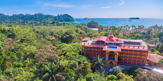 Discover Hotel San Bada, an exceptional haven in Costa Rica's Central Pacific Region, nestled within the captivating Manuel Antonio area. This natural wonderland is renowned for its pristine beaches, lush forests, and abundant wildlife, epitomized by the Manuel Antonio National Park. Our privileged location places you a mere 1-minute walk to the national park, a 5-minute walk from the enchanting Playa Espadilla beach, and a short 15-minute drive from vibrant Quepos. Additionally, we own a splendid ranch, approximately 1.5 hours away, offering thrilling explorations of primary forests and mesmerizing waterfalls. Our main campus boasts breathtaking ocean and rainforest views and an array of amenities, including 3 swimming pools, a restaurant serving delectable cuisine, a fitness center, internet access, and a rejuvenating spa. Our thoughtfully designed accommodations feature furnished balconies, air conditioning, and modern conveniences. Hotel San Bada seamlessly combines natural beauty with modern amenities for an unforgettable experience, with proximity to the national park and beach ensuring endless adventure. Welcome to a place where comfort, convenience, and nature converge for an extraordinary stay.