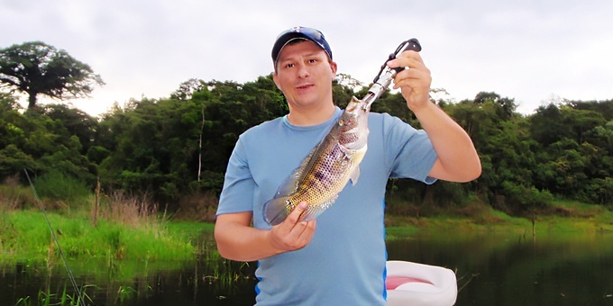 An angler holds a guapote