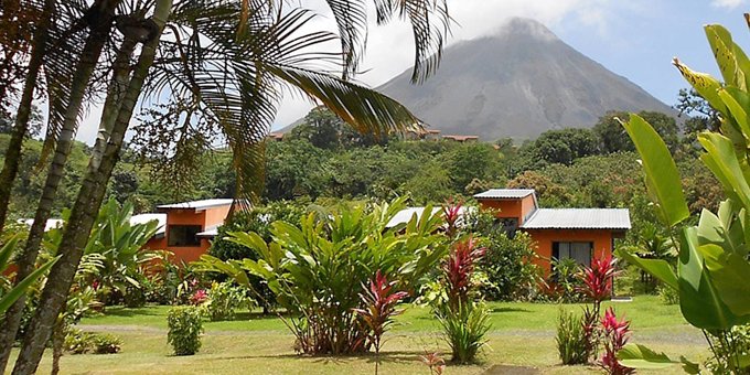 Hotel Erupciones Inn is a small, eco-style hotel, located on the  western side of La Fortuna, Costa Rica.   Located in the shadow of the imposing Arenal Volcano, guests of the  hotel receive a gorgeous view of this natural wonder.  Both affordable and accessible, Hotel  Erupciones Inn is a great accommodation option for people who’d like to visit  several different parts of the region, while not breaking their budget.  Hotel amenities include tropical gardens,  internet access, and private parking.