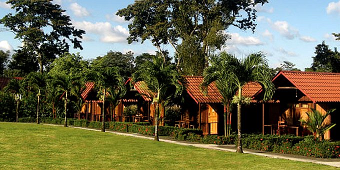 Hotel Arenal Green in La Fortuna, Costa Rica, is a charming cabin-style hotel nestled in lush tropical gardens with stunning views of the iconic Arenal Volcano. The hotel offers comfortable and well-appointed rooms designed with a blend of rustic charm and modern amenities. Guests can unwind and relax in the hotel's beautiful gardens, taking in views of Arenal Volcano. The on-site restaurant serves delicious local and international cuisine, showcasing the flavors of Costa Rica. The friendly and attentive staff are dedicated to providing exceptional service. Hotel Arenal Green offers a tranquil and scenic retreat for budget-conscious nature enthusiasts and adventurers seeking an unforgettable experience in La Fortuna. Lodge amenities include a restaurant, gardens, wireless internet, secure parking, and a safety deposit box. 