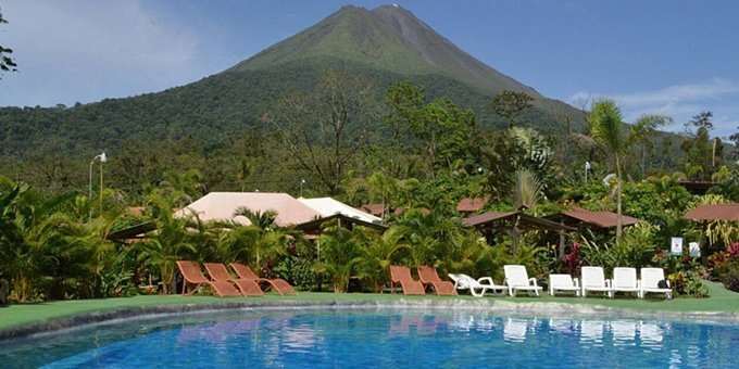 Jardines del Arenal is a budget friendly hotel located outside  of La Fortuna, which is lined with a variety of different native plants.  Take a calm walk through the tropical  gardens, gaze at the region’s healthy rainforest, and have the vacation of a  lifetime!  Amenities include hot water,  AC, WiFi internet, and secure parking.