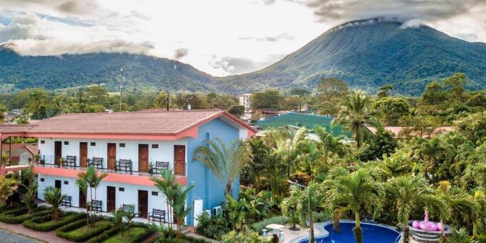 Hotel Vista del Cerro in La Fortuna, Costa Rica, is a small budget-friendly hotel surrounded by lush tropical gardens and boasting stunning views of the majestic Arenal Volcano. The hotel offers affordable rooms, tastefully decorated with a blend of modern amenities and local touches. Guests can unwind and enjoy the serene atmosphere by the outdoor pool or relax on the terrace while taking in the picturesque surroundings. The hotel's on-site restaurant serves delicious Costa Rican and international cuisine, prepared with fresh, locally sourced ingredients. The friendly and attentive staff are dedicated to ensuring a memorable stay. With its tranquil ambiance, breathtaking views, and warm hospitality, Hotel Vista del Cerro provides a perfect retreat for economically-focused travelers seeking relaxation and exploration in La Fortuna.