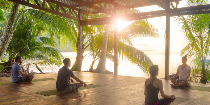 A group practices yoga