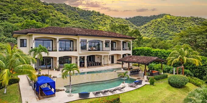 <strong>Villa Buena Onda is a luxurious all inclusive villa perched on a hillside overlooking Playas del Coco and the Papagayo Bay.</strong> This exclusive eight-room boutique style villa specializes in personalized service and includes an exceptional a la carte meal plan. Guests can also take advantage of the free shuttle service to explore the local beach. Amenities include incredible ocean views, a beach shuttle, two-tiered swimming pool, restaurant, outdoor pool bar and lounge, wet bar, spa services, tropical gardens, and free international calls and internet.