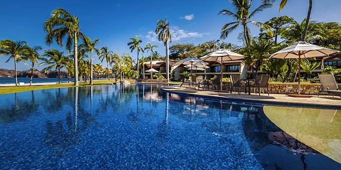 The Palms at Playa Flamingo is a community of luxury rental villas located in front of the gorgeous Flamingo Beach. Guests of the Palms can expect some of the finest vacation rentals in Costa Rica. In addition to beach access, the Palms at Playa Flamingo offer a swimming pool, spa, fitness room, bar, laundry facilities, spa, onsite parking, tropical gardens and Wi-Fi for guest use. Please note this property has different payment and cancellation policies than most other properties in Costa Rica. Please ask your agent for details.