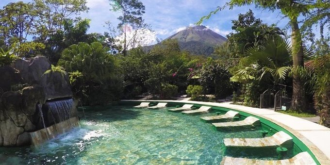 Paradise Hot Springs Thermal Resort in La Fortuna, Costa Rica, is a tropical oasis that offers a perfect blend of relaxation and adventure. Nestled amidst lush gardens and surrounded by natural beauty, the resort boasts a variety of thermal pools fed by hot springs, allowing guests to immerse themselves in the healing and rejuvenating waters. The resort offers comfortable and spacious accommodations, ranging from cozy rooms to private villas, all designed with a touch of rustic elegance and modern amenities. Guests can indulge in soothing spa treatments, enjoy delicious cuisine at the on-site restaurant, or simply unwind in the tranquil atmosphere of the resort. The resort's location provides easy access to explore the nearby Arenal Volcano, hanging bridges, and other outdoor activities such as hiking, wildlife spotting, and zip-lining. Whether seeking relaxation or adventure, Paradise Hot Springs Thermal Resort offers a memorable and enchanting experience in the heart of La Fortuna, Costa Rica.