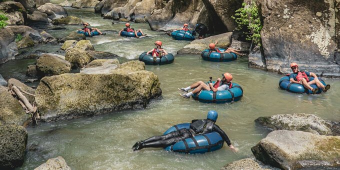 Experience the thrill of White Water Tubing at Rio Perdido, a popular activity that takes you through a mile of stunning canyon landscape, featuring narrow rock walls and rolling whitewater. Look out for hot waterspouts and wildlife such as monkeys and tropical birds along the way. While most of the course offers a relaxing float, there are exciting slides and rapids for added adventure. Available daily with different time slots, this one-hour activity is suitable for those aged 12 and above, with weight and height restrictions. Please note that contact with exposed rocks may occur, resulting in minor cuts or bruises.