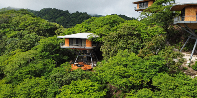 Experience the luxury and tranquility of Suitree Experience Hotel in Sardinal, Costa Rica. Our modern treehouse rooms provide a spacious retreat with unique amenities, including a private mini-bar and an immersive shower surrounded by nature. With golf car access and 24-hour room service, convenience and comfort are ensured. Discover the beauty of Guanacaste, immerse yourself in Costa Rican culture, and indulge in a gastronomic journey at our restaurant. Embrace sustainability and support the local community while enjoying the breathtaking mountain views. Of course, you can also enjoy some of Costa Rica's most beautiful beaches, some of which are within a 20-minute drive of the hotel. Suitree Experience Hotel offers a truly exceptional escape in a serene valley setting.