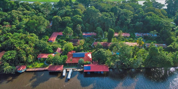 La Baula Lodge is a charming but rustic eco-lodge nestled in the heart of Tortuguero, Costa Rica. Located along the picturesque canals and lush rainforest of Tortuguero National Park, the lodge offers a unique and immersive experience in the region's biodiversity and natural wonders. The lodge is surrounded by captivating flora and fauna, making it a haven for nature enthusiasts and wildlife lovers. The comfortable rooms are designed to blend harmoniously with the environment, providing a serene and tranquil atmosphere for guests to unwind and connect with nature. Guests can enjoy guided tours through the nearby canals, where they can spot various wildlife species, including howler monkeys, colorful birds, and elusive sloths. The lodge's commitment to sustainability and conservation adds to its allure, offering a responsible and eco-friendly stay for travelers who wish to explore the beauty of Tortuguero while minimizing their impact on the environment. NOTE: All visitors to the region must pay the entrance fee to the national park, which is $15 per adult, $5 per child between the ages of 5 - 11, and free for children 4 years or less. The entrance fee must be paid in person upon arrival to Tortuguero and is not included in your stay at the lodge.