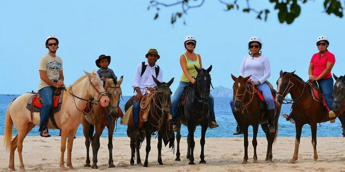 Imagine Forest and Beach Horseback Riding at Playa Conchal! Embark on a unique journey through the lush forests of Guanacaste with our gentle and well-trained horses. Our horseback riding adventure offers a diverse range of trails, winding through forests, mountains, and even beaches, allowing you to immerse yourself in an authentic natural experience. Lasting approximately 2 hours, our guided horseback ride ensures safety and comfort, as our horses are gentle and the pace is tailored to your comfort level. Equipped with top-notch gear, we prioritize your safety and enjoyment. Before setting off, we provide a comprehensive briefing to refresh your memory on horseback riding techniques and proper horse care. The adventure begins by traversing a quaint village before venturing into the mountain trails, offering glimpses of local wildlife. The journey unfolds, leading us to the mesmerizing sight of the ocean. Riding along the coastline is a possibility, as we have access to special and safe beach zones. The ride culminates at a local family house, where you can savor a unique and traditional snack, adding a delightful touch to the experience. To ensure your comfort and safety during the ride, we recommend wearing long pants, closed shoes, and bringing essentials like insect repellent, sunscreen, and a hat. Our package includes well-cared-for horses, expert guidance, necessary equipment, refreshing beverages, entrance fees, and insurance coverage, ensuring you can fully enjoy this captivating horseback adventure.