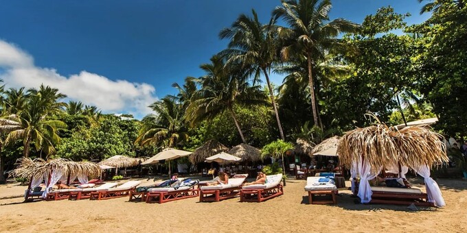 Welcome to Locanda Samara Beach Hotel, a hidden gem nestled along the pristine shores of Samara Beach in Costa Rica. Our intimate budget-friendly beachfront hotel boasts 17 well-appointed rooms that provide the perfect blend of comfort and rustic charm, ensuring a tranquil stay just steps from the Pacific Ocean. Start your day with a delectable breakfast at our inviting restaurant, where you can savor local flavors while enjoying picturesque ocean views. Immerse yourself in the pura vida lifestyle as you relax by our refreshing pool, enveloped by lush tropical gardens. For those seeking adventure, Samara Beach offers a wide range of thrilling activities, from surfing and horseback riding to exploring the vibrant marine life while kayaking and snorkeling. Nature enthusiasts will be captivated by the nearby wildlife reserves, where you can observe diverse species of birds and animals in their natural habitat. Our dedicated staff is always at your service, ensuring your stay is filled with unforgettable moments and relaxation. Whether you're a couple in search of a romantic getaway, a family seeking quality time together, or a group of friends embarking on an adventure, Locanda Samara Beach Hotel welcomes you to experience the pure essence of Costa Rica's tropical paradise.