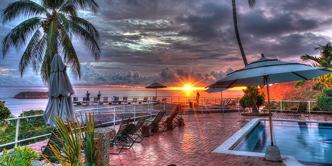 Hotel Costa Verde is a unique and eco-friendly hotel situated in Manuel Antonio, Costa Rica. Perched on a hillside overlooking the pristine rainforest and the Pacific Ocean, the hotel offers breathtaking panoramic views and a tranquil atmosphere. The property features a variety of accommodations, including spacious rooms, suites, and even airplane fuselages converted into unique lodging options. Guests can relax by the outdoor pool, enjoy delicious cuisine at the on-site restaurant, or indulge in a rejuvenating spa treatment. The hotel is committed to sustainable practices and has implemented eco-friendly initiatives such as recycling programs and the use of solar energy. Additionally, Hotel Costa Verde is conveniently located near Manuel Antonio National Park, renowned for its abundant wildlife and stunning beaches, providing easy access to explore the natural wonders of the region. With its stunning setting, environmentally-conscious practices, and comfortable accommodations, Hotel Costa Verde offers a memorable and eco-friendly experience in Manuel Antonio.  Amenities of the hotel include a bar, tropical gardens, swimming pools, a restaurant, and a multi-use pavilion. The hotel also offers guests free Internet so you can stay connected in paradise.