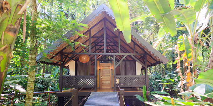 Almonds and Corals Hotel provides a jungle-beach experience like no other. Set in the rainforest of Manzanillo along the Southern Caribbean coast, this sustainable ecolodge describes itself as part safari camp and part eco-conscious boutique hotel. Screened guest bungalows sit on stilts above the damp rainforest floor, connected by a wooden plank walkway. A short walk within the property brings you to one of the prettiest beaches in Costa Rica. Guests of the lodge will enjoy amenities such as restaurant, bar, jungle spa, massage service, rental of kayaks, bikes, snorkeling equipment and boogie boards, wireless internet, laundry service, mini refrigerator, conference room, hiking trails and beach access.