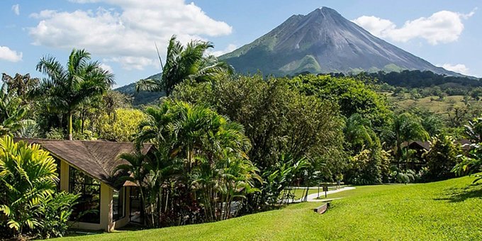 Arenal Paraiso Hotel Resort and Spa, located in La Fortuna, Costa Rica, is a budget-friendly and picturesque eco-resort backed by rainforest and offering stunning views of the majestic Arenal Volcano. The resort features affordable accommodations, including rooms, suites, and bungalows, designed with a blend of modern amenities and traditional Costa Rican aesthetics. Guests can unwind and rejuvenate at the lodge's spa, which offers a range of soothing treatments and therapies inspired by natural elements. The eco-resort boasts multiple swimming pools, including hot spring pools, where guests can relax and soak in the therapeutic mineral-rich waters. The on-site restaurant serves delicious Costa Rican and international cuisine, with an emphasis on fresh, locally sourced ingredients. The resort's location provides easy access to explore the nearby Arenal Volcano National Park, engage in adventure activities such as zip-lining and hiking, or simply relax and enjoy the serene natural surroundings. With its economically-friendly accommodations, attentive service, and breathtaking vistas, Arenal Paraiso Hotel Resort and Spa offers a perfect retreat for travelers seeking both relaxation and affordability at a hot springs eco-resort in La Fortuna, Costa Rica. In addition, Arenal Paraiso offers a swimming pool, restaurant and bar, spa and wellness center, a small fitness room, a computer station, and free WiFi in designated areas.
