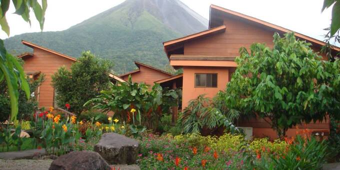 Hotel Silencio del Campo is a charming family run lodge in La Fortuna, Costa Rica. Positioned just across from the majestic Arenal Volcano, the hotel offers a serene environment with incredible views. The tropical gardens attract many birds, their songs adding to the ambiance. Amenities of the lodge include a spa, swimming pool, hot springs, tropical gardens, working farm, restaurant, breakfast, Jacuzzi, and WiFi in some common areas.