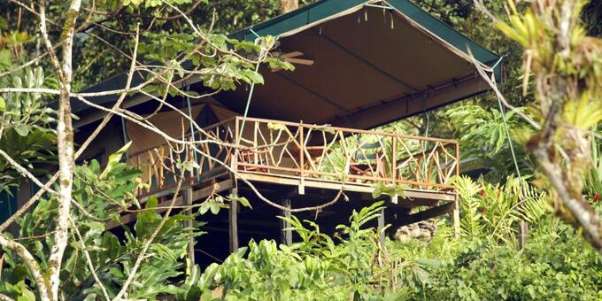 Rafiki Safari Lodge in Costa Rica is an enchanting and eco-friendly retreat nestled in the heart of the rainforest of the Savegre Valley. Embracing the principles of sustainability and adventure, our lodge offers unique safari-style accommodations that blend harmoniously with the surrounding natural beauty. Immerse yourself in the sights and sounds of the jungle as you stay in our comfortable and tastefully designed safari tents. Wake up to the melodies of exotic birds, embark on thrilling wildlife encounters, and explore hidden waterfalls and hiking trails. Indulge in farm-to-table cuisine at our on-site restaurant, which emphasizes fresh and locally sourced ingredients. With a commitment to conservation and immersive experiences, Rafiki Safari Lodge invites you to disconnect from the outside world and reconnect with nature in a truly unforgettable way. Lodge amenities include a restaurant, bar, pool, and water slide.
<p><strong>Please notice that to go into this lodge a 4x4 vehicle is required.</strong></p>