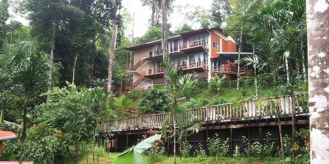 Mar y Selva Ecolodge is a charming eco-friendly retreat nestled in the heart of Uvita, Costa Rica. Surrounded by lush tropical rainforest, this lodge provides a serene and immersive experience in nature. The accommodations are thoughtfully designed with sustainability in mind, featuring rustic yet comfortable rooms, cabins, and bungalows that blend harmoniously with the natural surroundings. Guests can unwind in the open-air common areas, take a refreshing dip in the natural spring-fed pool, or simply relax on their private terrace while listening to the sounds of the jungle. The on-site restaurant serves delicious meals made from locally sourced ingredients, including fresh fruits and vegetables from the lodge's own organic garden. Mar y Selva Ecolodge is committed to ecological practices. A range of eco-tours and activities, such as guided hikes, birdwatching tours, and visits to nearby waterfalls are available in the area. With its focus on sustainability and immersion in nature, Mar y Selva Ecolodge provides a tranquil and eco-conscious escape for nature enthusiasts and eco-conscious travelers alike. Hotel amenities include a swimming pool, restaurant, nature trails, and internet.