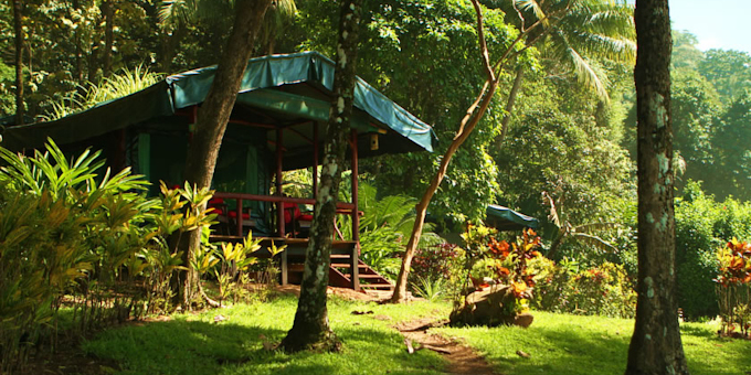 La Leona Ecolodge is a hidden gem nestled in the remote wilderness of Carate, Costa Rica. Located near the Corcovado National Park, this eco-friendly lodge offers a unique and immersive rainforest experience. Guests can choose from rustic yet comfortable accommodations, including cozy cabins and safari-style tents. The lodge is committed to sustainability, practicing eco-conscious initiatives such as solar power, composting, and organic farming. Nature enthusiasts will be delighted by the abundance of wildlife and the opportunity to explore the surrounding rainforest through guided hikes, wildlife spotting tours, and birdwatching excursions. The lodge also provides access to pristine beaches where visitors can relax, swim, or surf in the Pacific Ocean. With its off-the-grid location and commitment to environmental conservation, La Leona Ecolodge offers a serene and unforgettable retreat for those seeking an authentic and eco-friendly experience in Carate. Lodge amenities include a restaurant, bar, and nature trails. This hotel requires a 30-minute walk down the beach to access the property, but well worth it if you are physically fit.